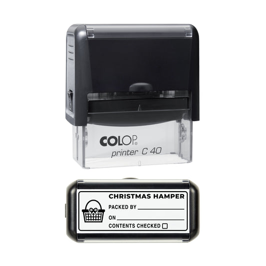 Stamp showing the Christmas Hamper Packed By design, 58 x 22mm COLOP C40 self-inking stamp, black ink